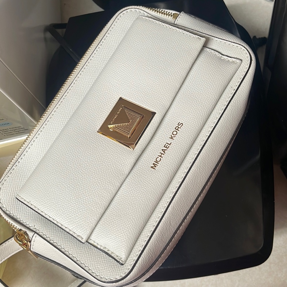 Whites crossbody Michael Kors. Selling for $30